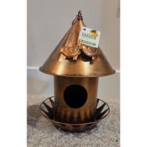 Gold colored metal bird house